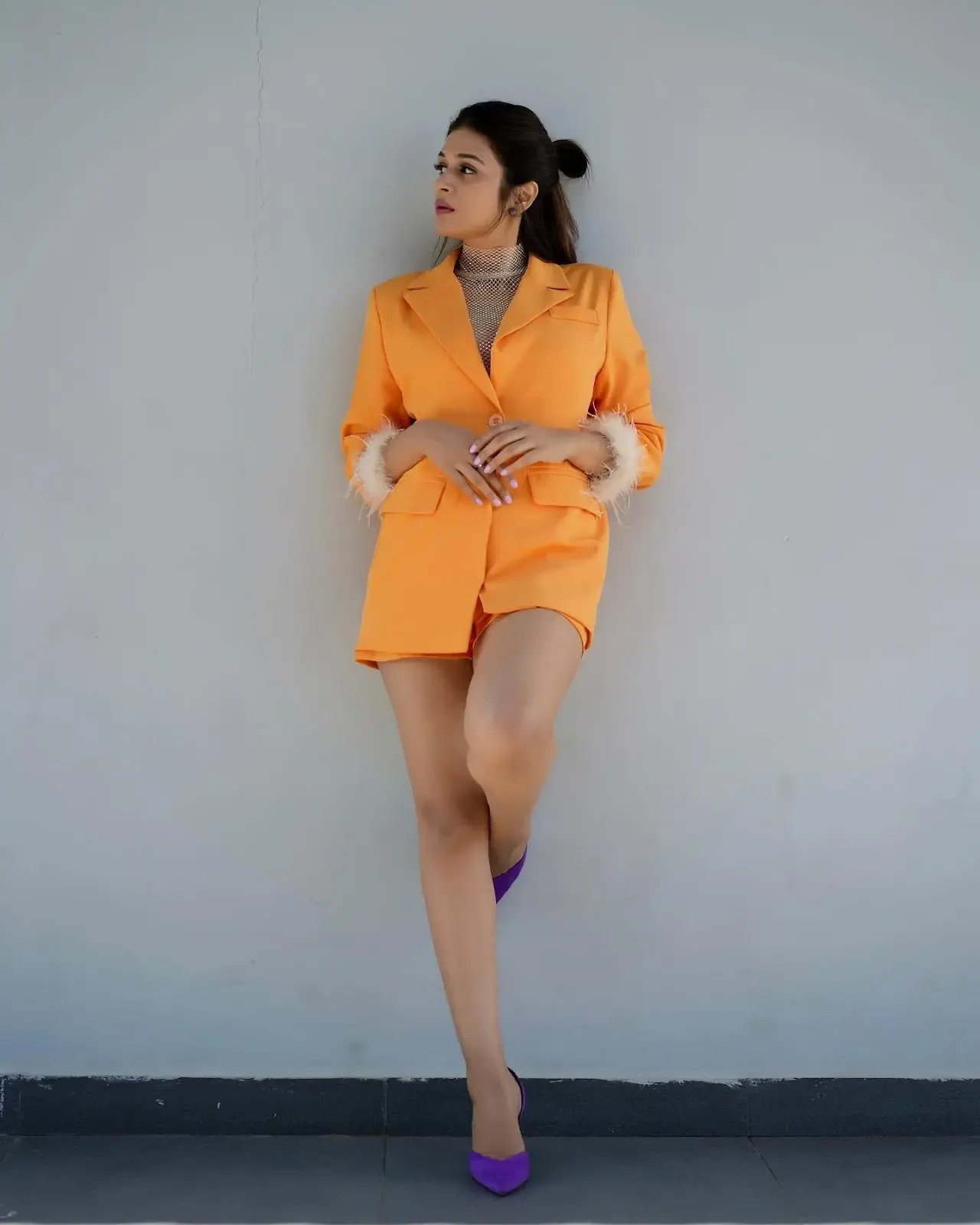 Actress Shraddha Das Long Legs Show in Mini Orange Top